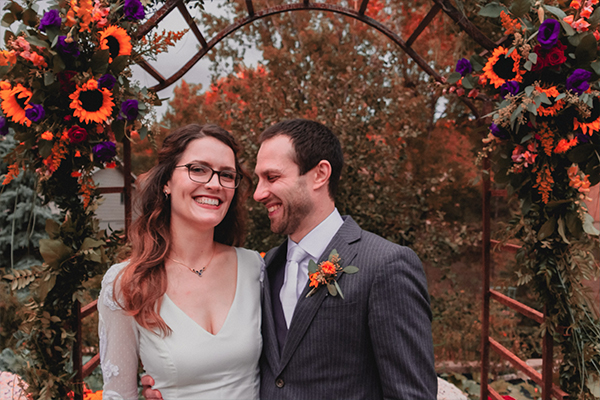 bride and groom smiling candidly